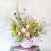 This arrangement creates with fragrant garden rose, Hyacinth, hydrangea, hellebore and seasonal