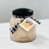Jar of snickerdoodle mix with a black lid and ribbon tag