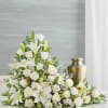Our all-white arrangement sends a heartfelt message of hope to those coping
