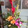 Exotic arrangement with orange lilies. 
