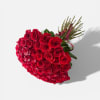 Heart-shaped bouquet of red roses with a ribbon wrap
