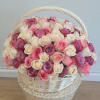 Basket of pink, white, and lavender roses