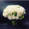 White hydrangea bouquet in a glass vase