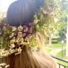 Flower crown with small white, pink, and purple blossoms