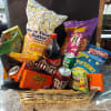 Basket of assorted snacks and soda wrapped in clear cellophane