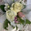 Small bouquet of white and pink roses with silver ribbon