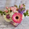 Pink and white mixed bouquet in a pink heart-shaped vase