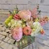 Pink and white mixed bouquet in a clear glass vase