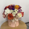 A mixture of roses, carnations, and fillers. 