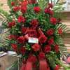 Large red rose and carnation standing spray with ribbon