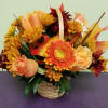Autumn flower basket with orange roses and yellow daisies