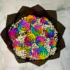Bouquet of rainbow-colored roses with white filler flowers
