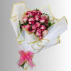 Bouquet of pink-and-white roses wrapped in white paper with a pink ribbon