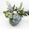 Mixed pastel flowers in a clear glass vase