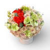 Bouquet of red and blush roses with pale green blooms in a white hat box