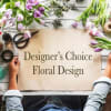 Designer’s Choice Floral Design sign surrounded by tulips and floral tools