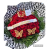 Red rose bouquet with a birthday ribbon, crown topper, and butterfly decorations