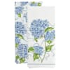 Two white napkins with blue hydrangea prints and green leaves