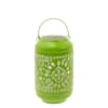 Green decorative lantern with a metal handle and cutout pattern