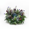 Natural-looking wreath of mixed garden blooms and greenery sized to gently surround