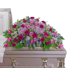 Pink and purple floral casket spray with roses and carnations
