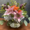 Flamingo Sunset is a vibrant floral arrangement bursting with warmth and elegance.
