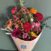  A hand wrapped bouquet with in season fall color fresh blooms