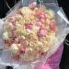 Large bouquet of blush and cream roses with pink accents