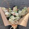 Large bouquet of white and blush roses with calla lilies and airy white blooms