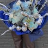Large blue bouquet with pale flowers and silver accents