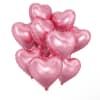 Cluster of pink heart-shaped balloons on white background
