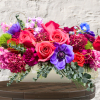 "Hand-crafted by accredited Master Florist Tricia Won (AIFD, EMC, IMF) using premium
