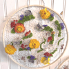A modern take on traditional fiber art, this handcrafted piece weaves real