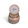 Pink scented candle in a glass jar with a lid