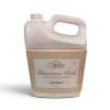 Bottle of Tyler Glamorous Wash laundry detergent in a beige carton