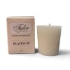 Beige votive candle beside its matching box