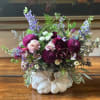 Celebrate the rich beauty of fall with our Autumn Enchantment Arrangement, artfully