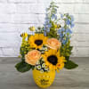 Sunflowers and peach roses in a yellow vase with bee decorations