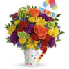 Colorful bouquet of roses and daisies in a decorated vase with balloons