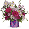 Pink roses and white alstroemeria in a patterned vase