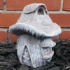 A short, toadstool fairy house to add a touch of magic to