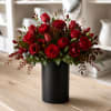Red rose bouquet in a black vase