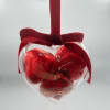 Heart-shaped chocolate gift box with a red ribbon bow