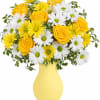 Yellow roses and white daisies in a yellow vase