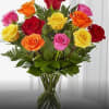 Mixed-color roses in a clear glass vase