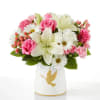 Pink roses and white lilies in a white vase with a gold dove design
