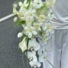 White bridal bouquet with orchids, calla lilies, and tulips