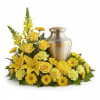 A gentle and intimate arrangement designed to embrace a cremation urn. The