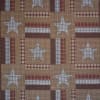 Patchwork quilt with stars and plaid squares in red, tan, and blue