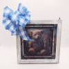 A sweet plush teddy bear with a blue ribbon is the heart
